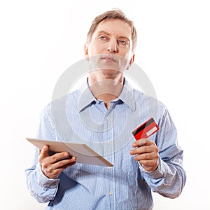 Portrait of young man holding tablet