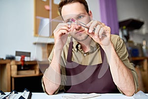 Man Appraising Stones in Shop