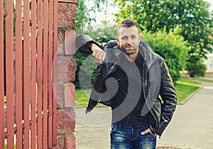 portrait of the young man in a leather jacket