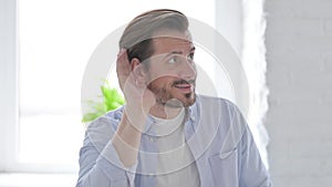 Portrait of Young Man Listening Secret Carefully Information