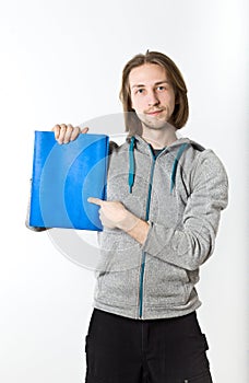 Portrait of young man with long blond hair