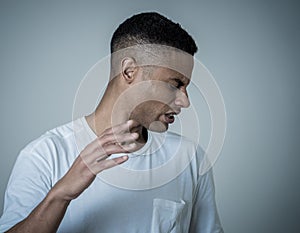 Portrait of a young man looking scared and shocked at something. Human expressions and emotions