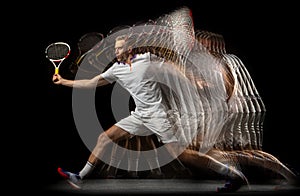 Portrait of young man, male tennis player in motion and action isolated on dark background. Stroboscope effect.