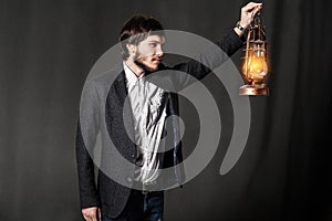 Portrait of a young man with oil lamp