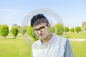 Portrait of young man outdoor ,handsome teenager.