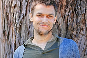 Portrait of a young man in a park