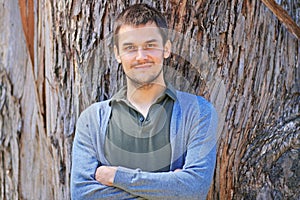 Portrait of a young man in a park