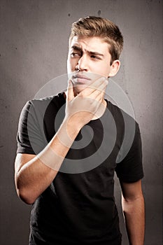 Young man with pensive expression