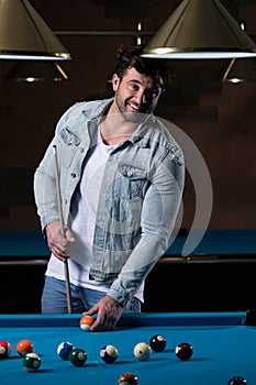 Portrait Of A Young Man Playing Billiards