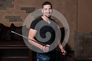 Portrait Of A Young Man Playing Billiards