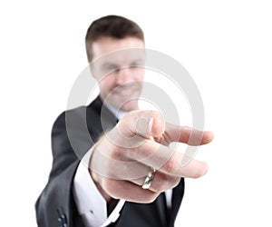 Portrait of a young man pointing his finger at you