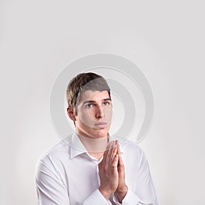 Portrait young man praying