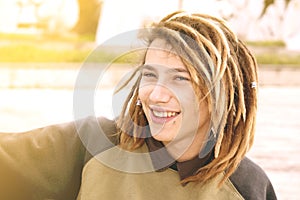 Portrait of a young man with rasta hairs