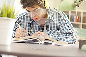 Portrait of young man reading book