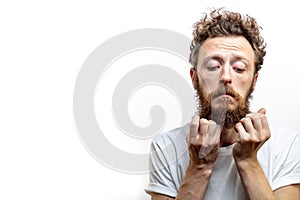 Portrait of young man with sad face expression isolated on gray background