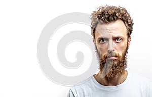 Portrait of young man with sad face expression isolated on gray background