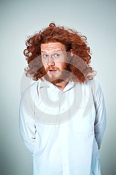 Portrait of young man with shocked facial expression