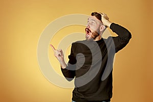 Portrait of young man with shocked facial expression