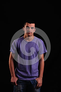 Portrait of young man wearing t-shirt looking at the camera