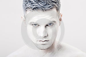 Portrait of young man with white face paint. Professional Fashion Makeup. fantasy art makeup