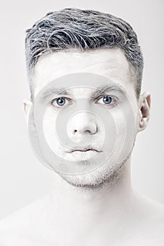 Portrait of young man with white face paint. Professional Fashion Makeup. fantasy art makeup