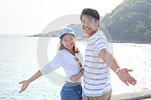 Portrait of young man and woman relaxing and happy emotion on se