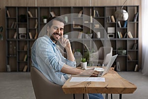 Portrait of young man work at home office by pc