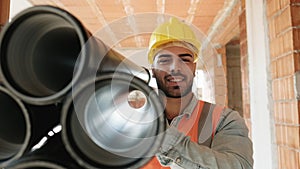 Portrait Of Young Man Working In Construction Site