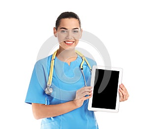 Portrait of young medical assistant with stethoscope and tablet on white background