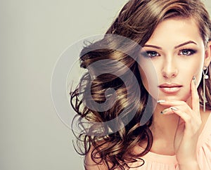 Portrait of young model with wavy, dense hair.