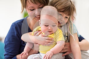 Portrait of young mother with  her kids