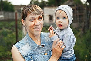 Portrait of a young mother taking care of her cute baby. Baby with mom