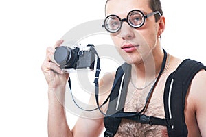 Portrait of a young nerd with old fashioned camera