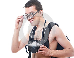 Portrait of a young nerd with old fashioned camera