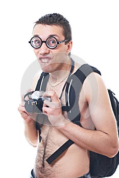 Portrait of a young nerd with old fashioned camera