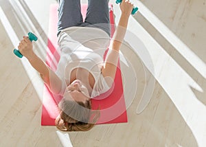 Portrait of young obese woman working out