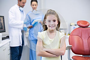 Portrait of young patient standing with arms crossed