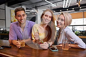 Portrait of young people meeting for the first time in a bar