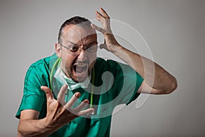 Portrait of a young physician shouting