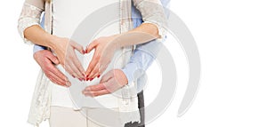 Portrait of a young pregnant couple on a white background show the love sign photo