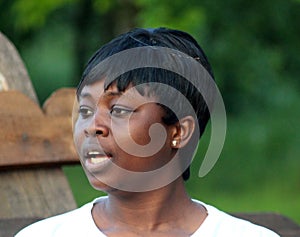 Portrait of a young pretty African-American student with a short haircut. People of African descent. The girl is a representative