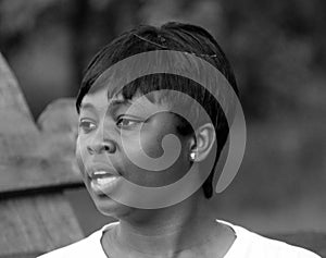 Portrait of a young pretty African-American student with a short haircut. People of African descent. The girl is a representative