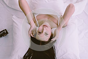 Portrait of young pretty asian woman lying down on bedroom,Sexy female and perfect skin,Close up face