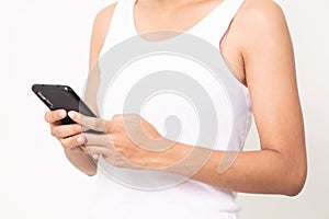Portrait of a young pretty asian woman playing games on mobile phone