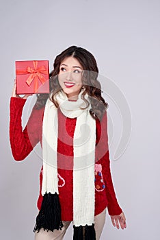 Portrait of young, pretty and happy woman with christmas gift box