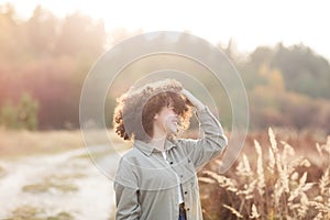 Portrait of young pretty mixed race teen girl outdoor in sunlight. happy woman