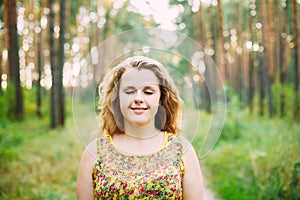 Portrait Of Young Pretty Plus Size Caucasian Happy Girl Woman With Closed Eyes,