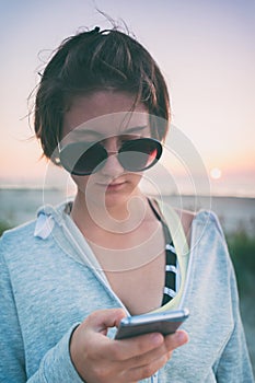 Portrait of romantic young pretty teenage girl on the beach