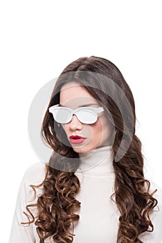 Portrait of young pretty woman with bright makeup wearing white opaque sunglasses,