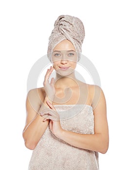 Portrait of young pretty woman with towels